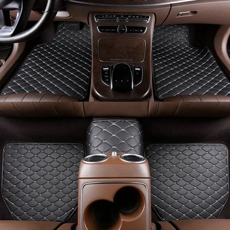 Interior view of a car showing dark brown quilted leather floor mats and trim.