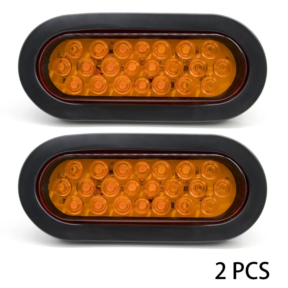 Two universal LED brake and marker lights with multiple amber reflectors