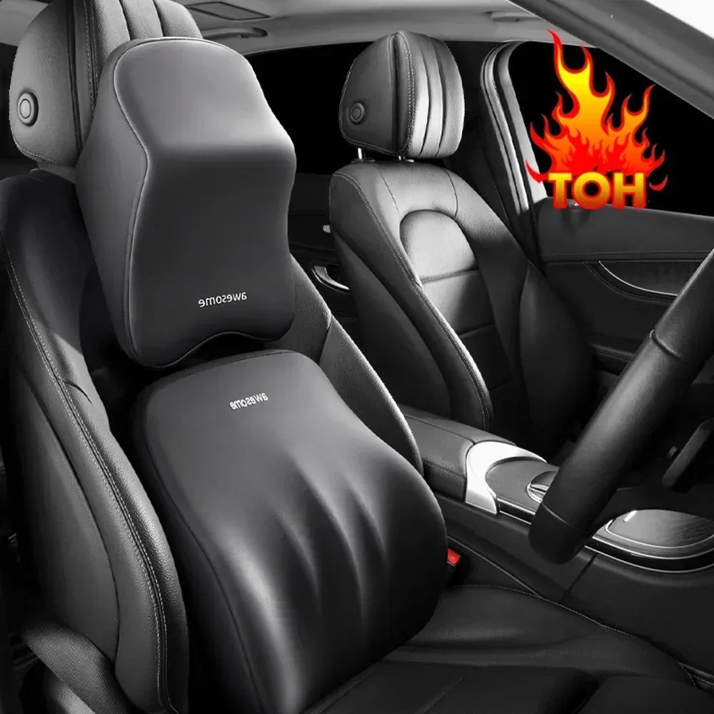 Interior view of a car seat showing an ergonomic lumbar and neck support cushion on the driver's seat.