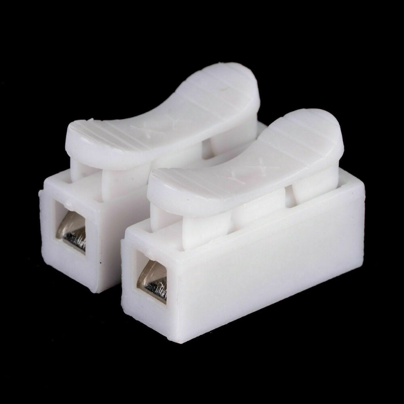 Two white plastic wire connectors with metal terminals for quick splicing.