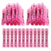 A collection of pink and clear durable heat shrink wire connectors arranged in rows.