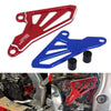 Red and blue CNC aluminum front sprocket cover for dirt bikes shown in detail.