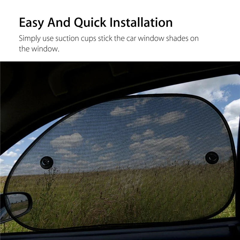 Une vitre de voiture est recouverte d'un pare-soleil en maille sombre, installé avec des ventouses.