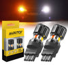 Two black LED light bulbs for automotive turn signals shown next to their packaging box.