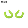 A pair of bright lime green universal car exterior bumper tow hook covers.