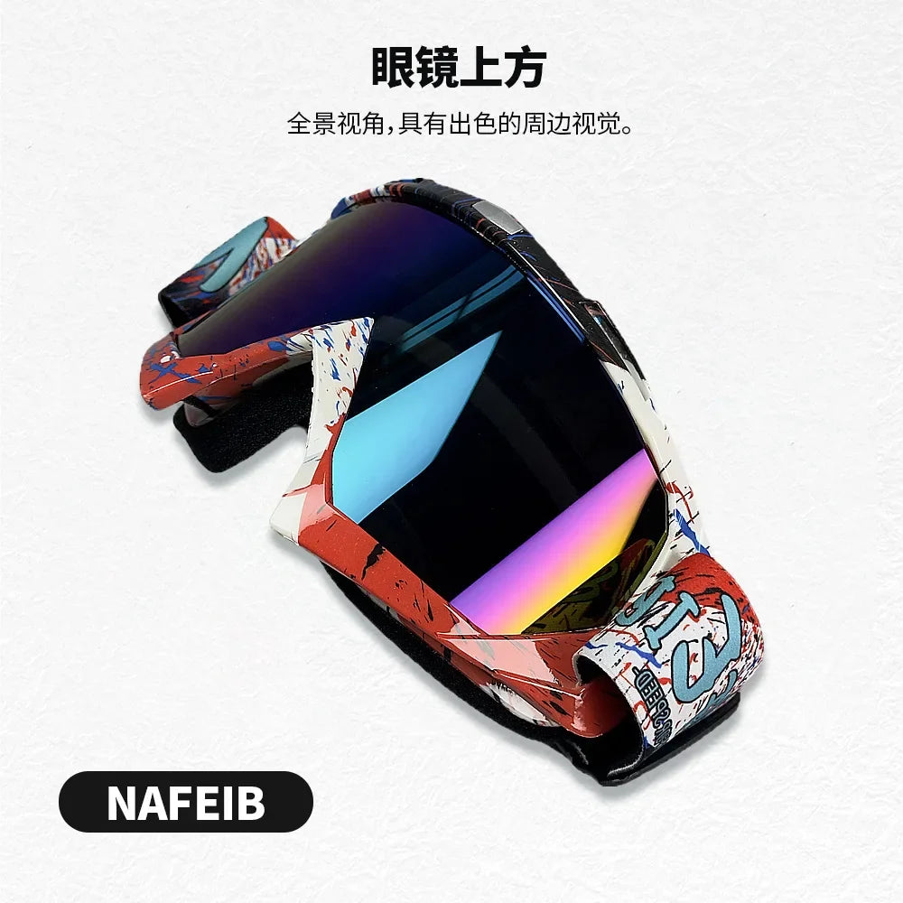 A pair of motorcycle off-road goggles with a colorful, patterned lens shown from the top view.