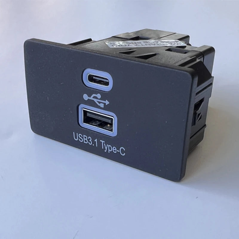 A black USB 3.1 Type-C adapter or hub is shown on a white surface.