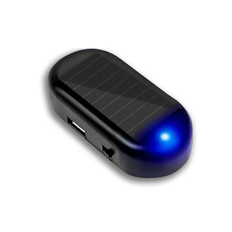 A black solar powered anti-theft car warning light with a blue glowing tip.