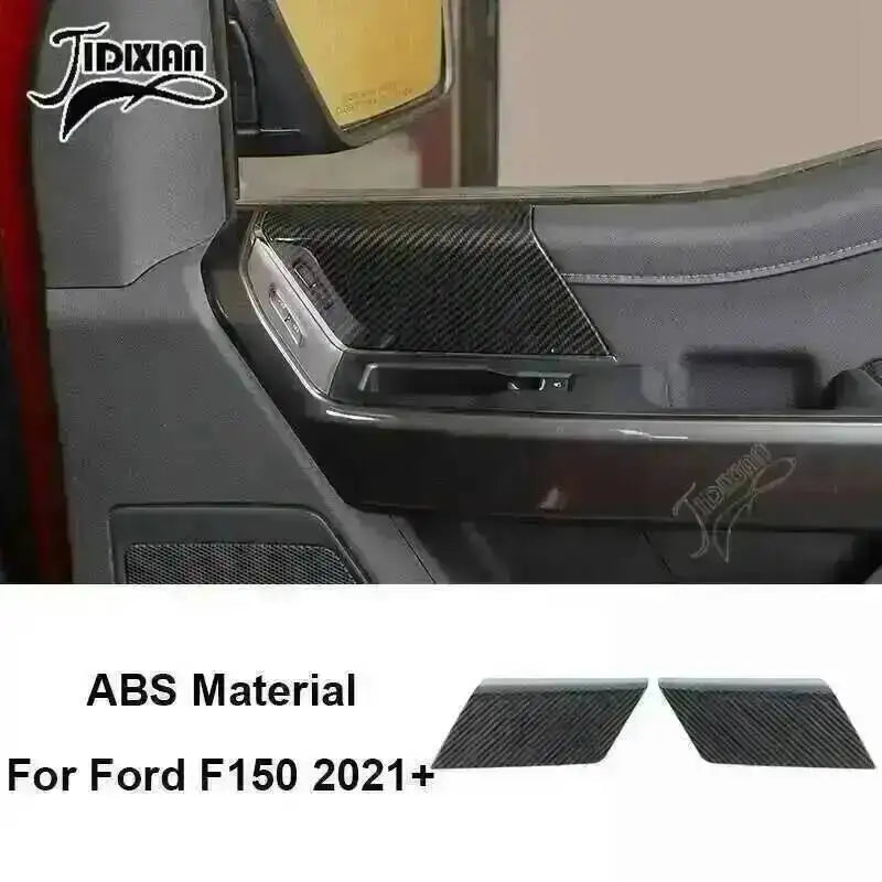 Close-up view of black carbon fiber grain interior trim for a Ford F150 2021+ truck.