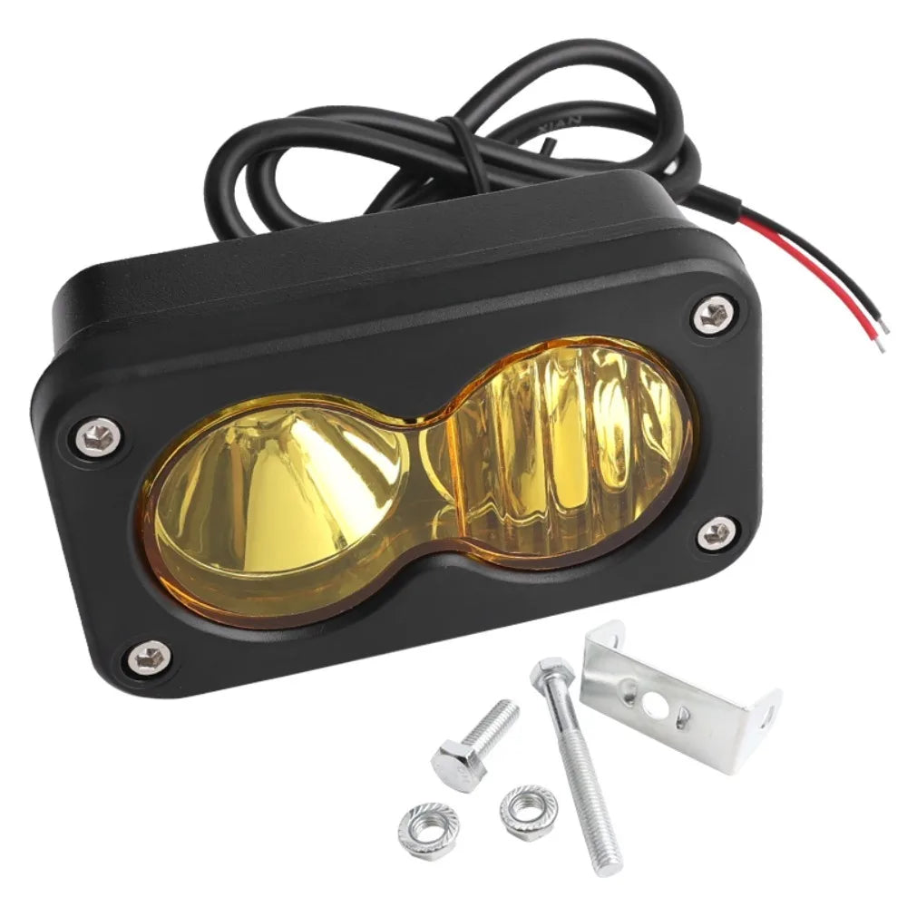Black LED headlight switch kit with a yellow lens and mounting hardware for a Segway Talaria