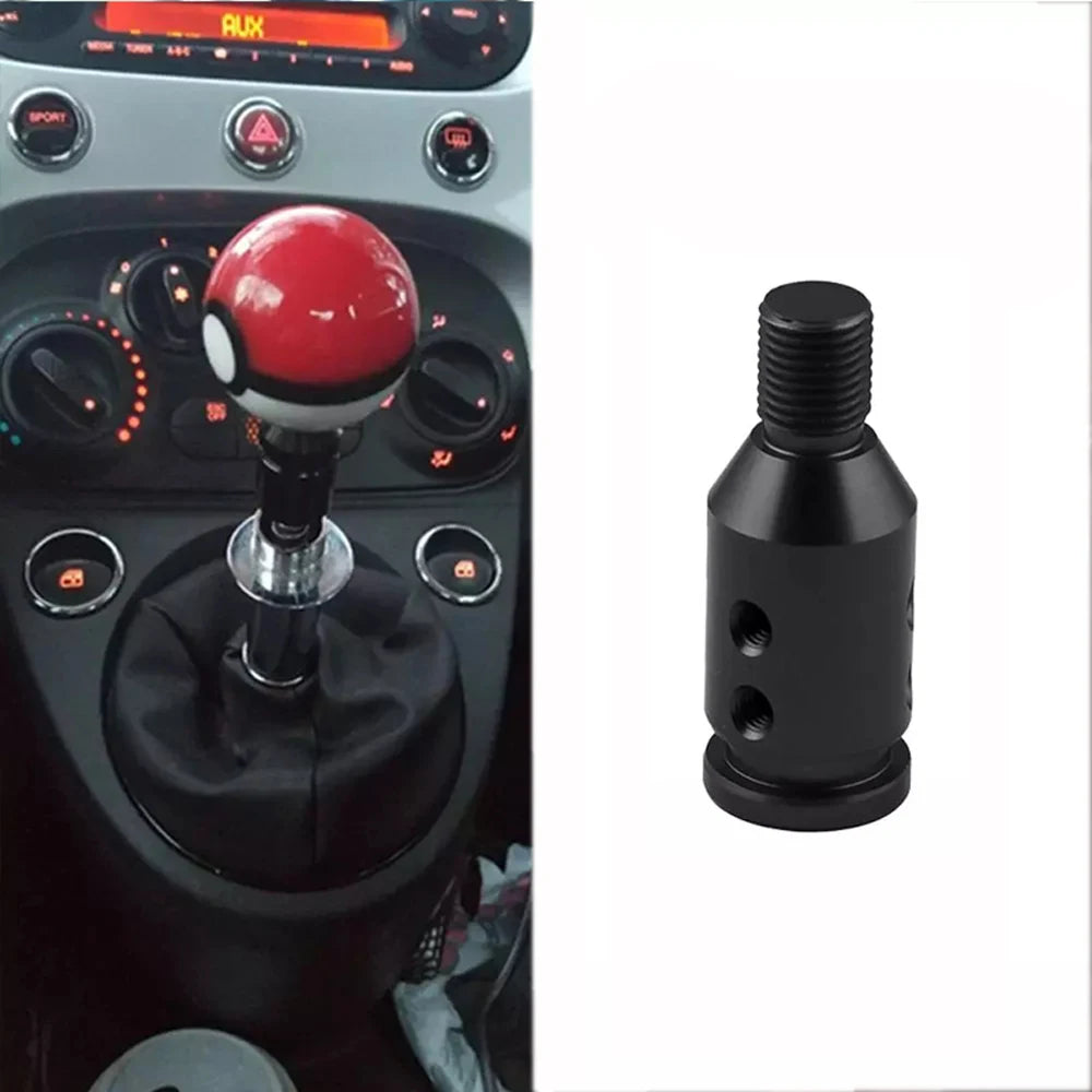 A black gear shift knob adapter with a threaded top and base, used for manual transmission.