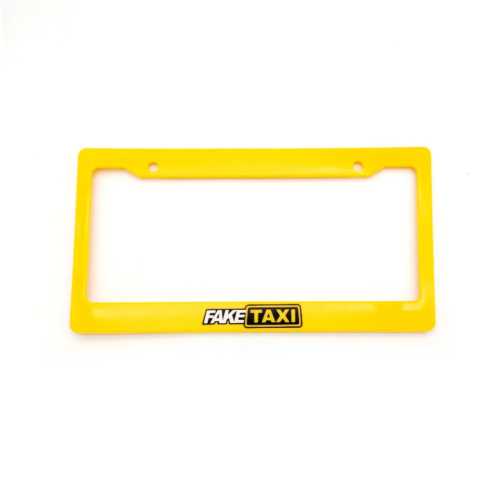 Yellow license plate frame decoration with the text FAKE TAXI