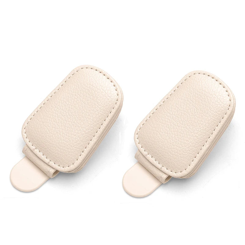 Pair of light beige magnetic leather sunglasses holders for car sun visors