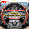 Two pieces of red and black carbon fiber steering wheel cover suitable for a 38cm diameter steering wheel.