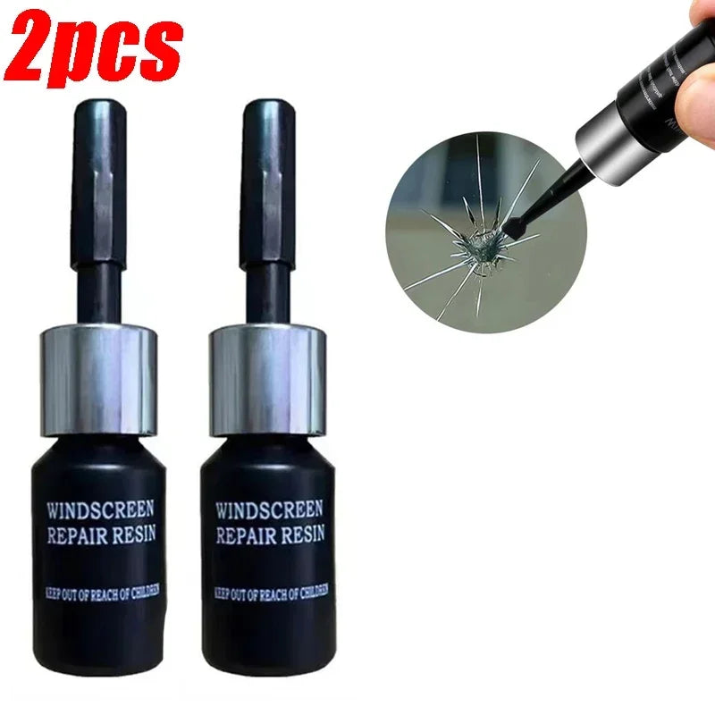 Two tubes of windshield repair resin with a applicator tip shown next to the product.