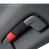 A close-up of a gray car roof handle cover made of Alcantara fabric with a black grip and red accent.