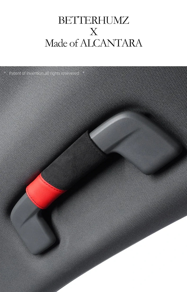 A close-up of a gray car roof handle cover made of Alcantara fabric with a black grip and red accent.