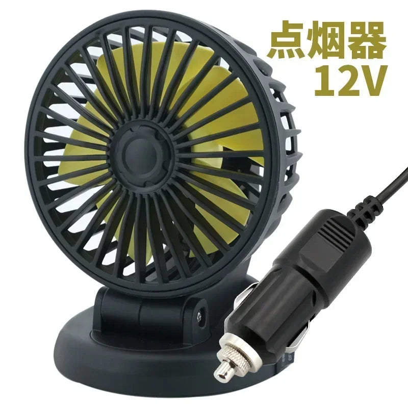 A black 12V spotlight fan with a wire connector and base.
