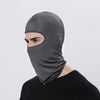 A man wearing a dark gray all-weather windproof balaclava face mask.