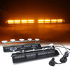 A set of emergency dash strobe lights mounted on a black panel, illuminated brightly against a dark background.