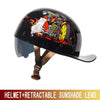 Black motorcycle helmet featuring a fiery graphic of a rider on a bike with a retractable sunglass lens.