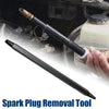 A black spark plug removal tool is shown next to a hand, demonstrating its use for extracting spark plugs.