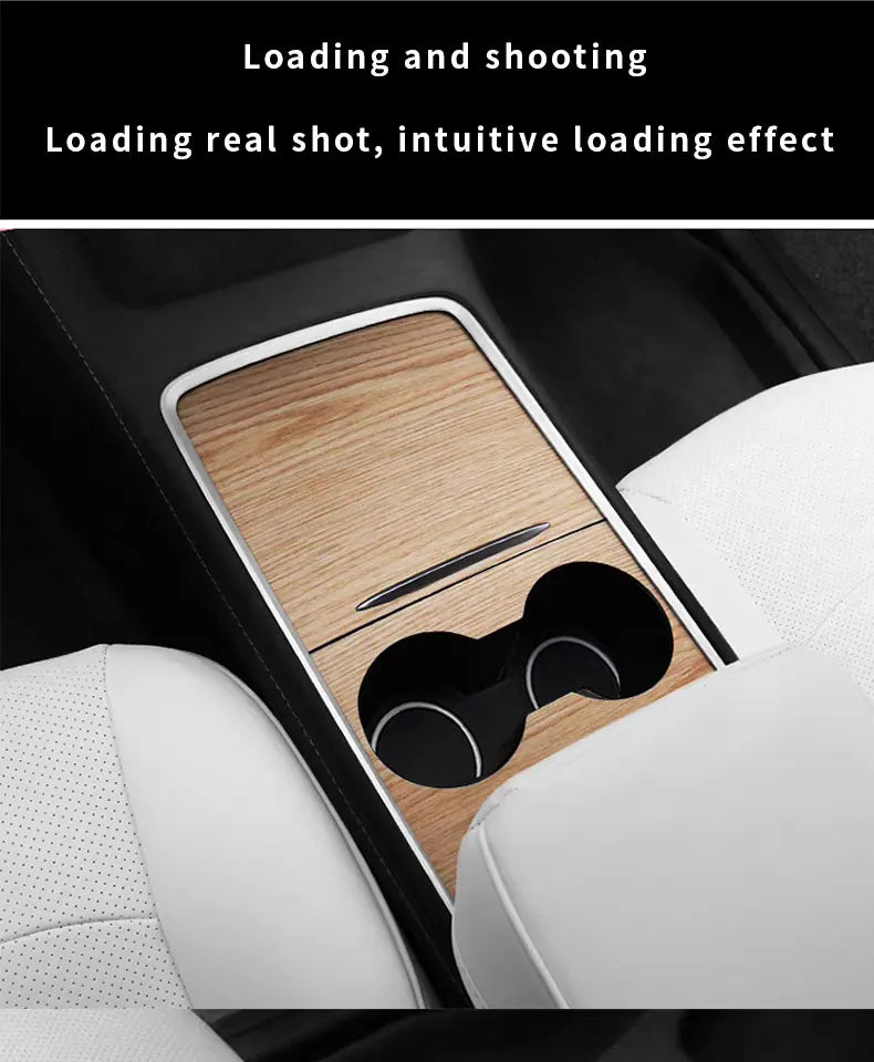 A close-up view of a wood grain dashboard cover for a Tesla Model Y showing the loading and shooting mechanism.