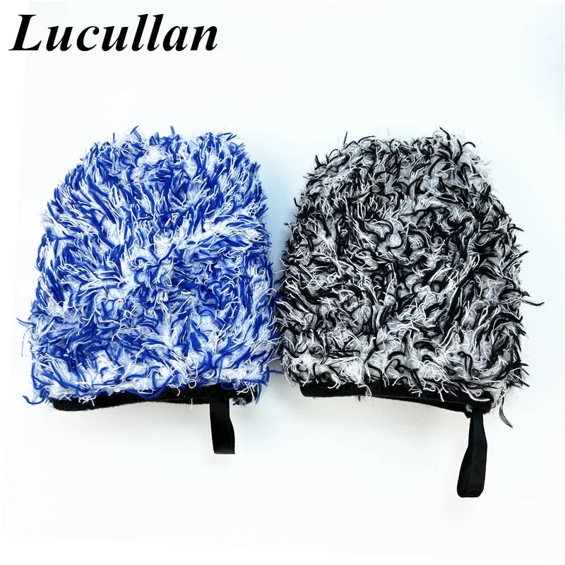 A pair of blue and black microfiber detailing wash mitts with fluffy texture.