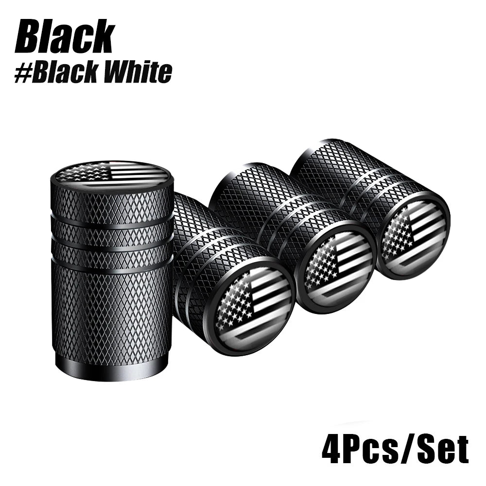 A set of four black and white American flag aluminum tire valve caps.