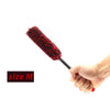 A hand holds a red wool cleaning brush with a black handle, demonstrating the size M brush.