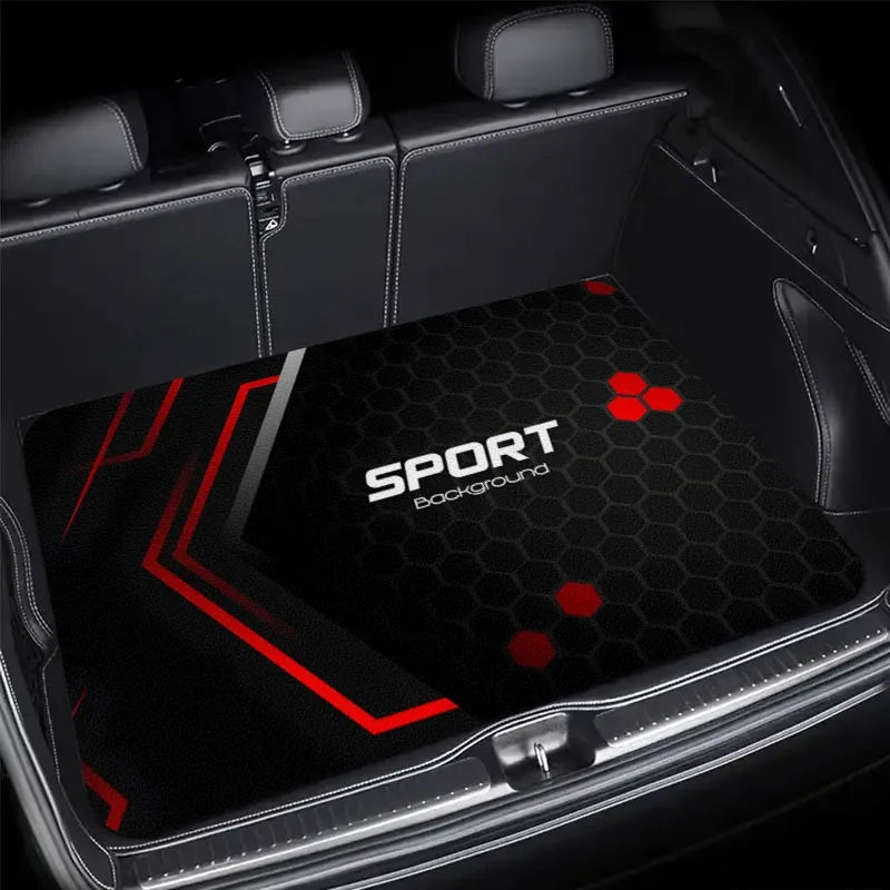 A black car trunk mat with a red geometric pattern and the word SPORT background.