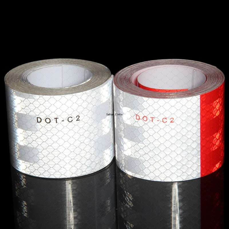 Roll of DOT-C2 high-visibility reflective safety tape with a white and red striped pattern