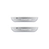 Two silver projector door sill lights showing a custom logo design.