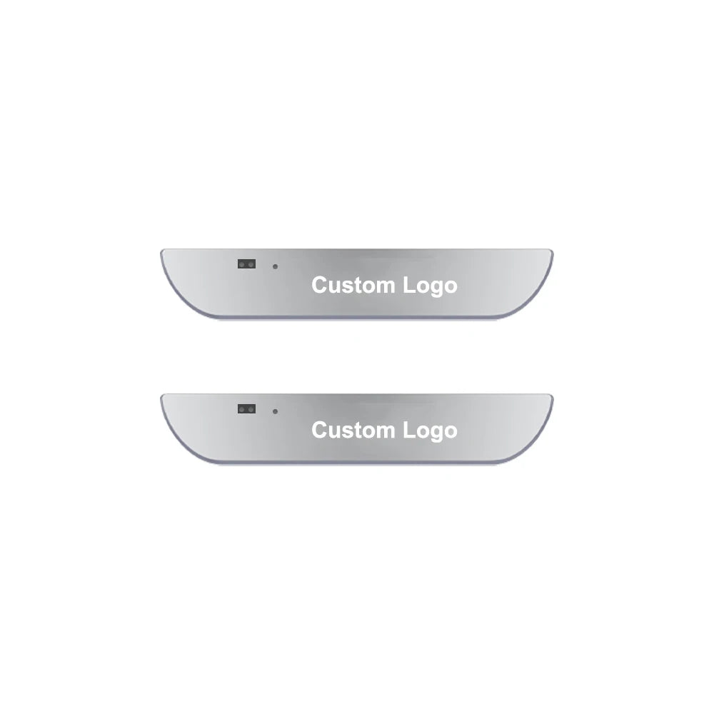 Two silver projector door sill lights showing a custom logo design.