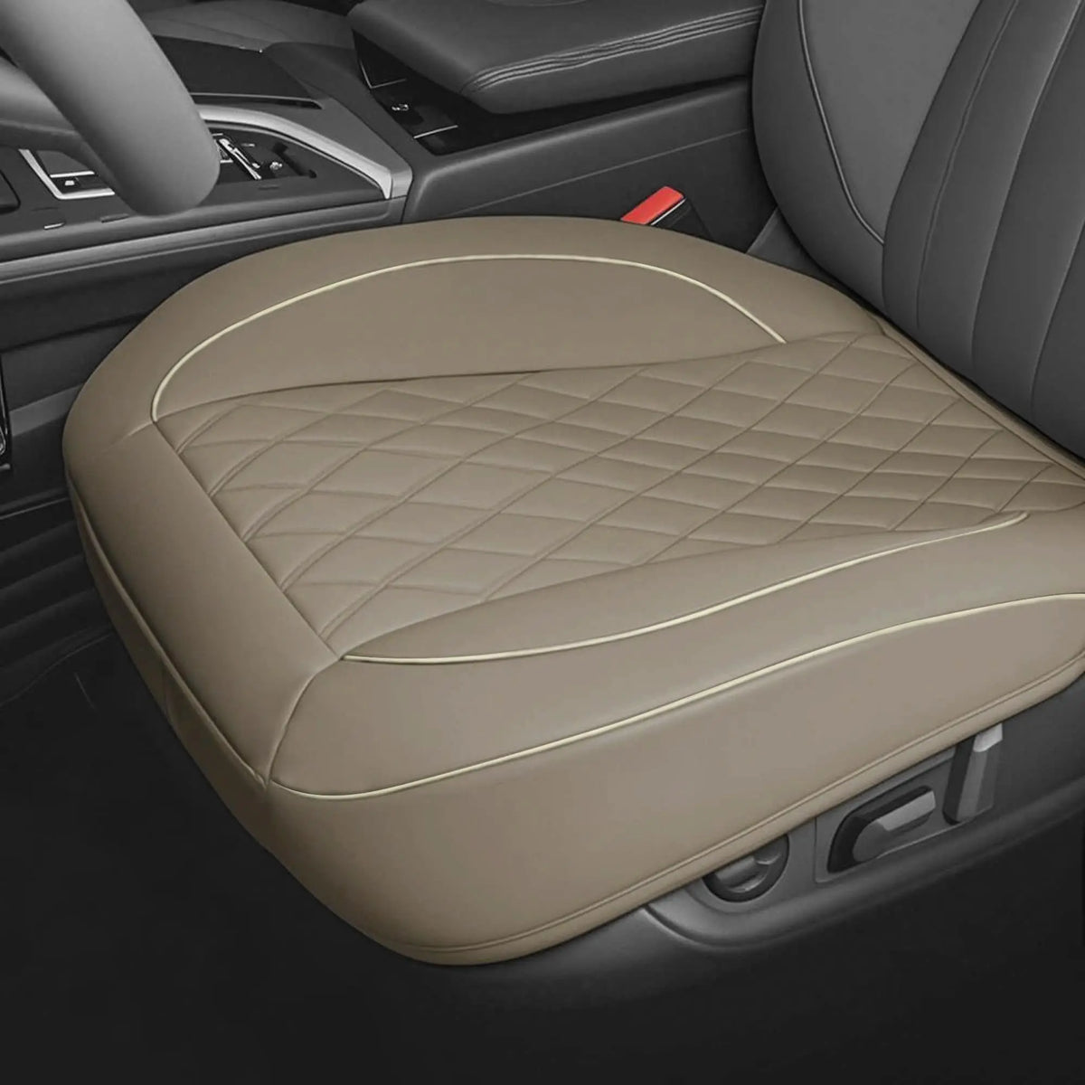 A tan PU leather car seat cover protector with diamond stitching is shown on a driver's seat.