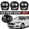 Two black car print hood headrest covers shown on a white car interior.