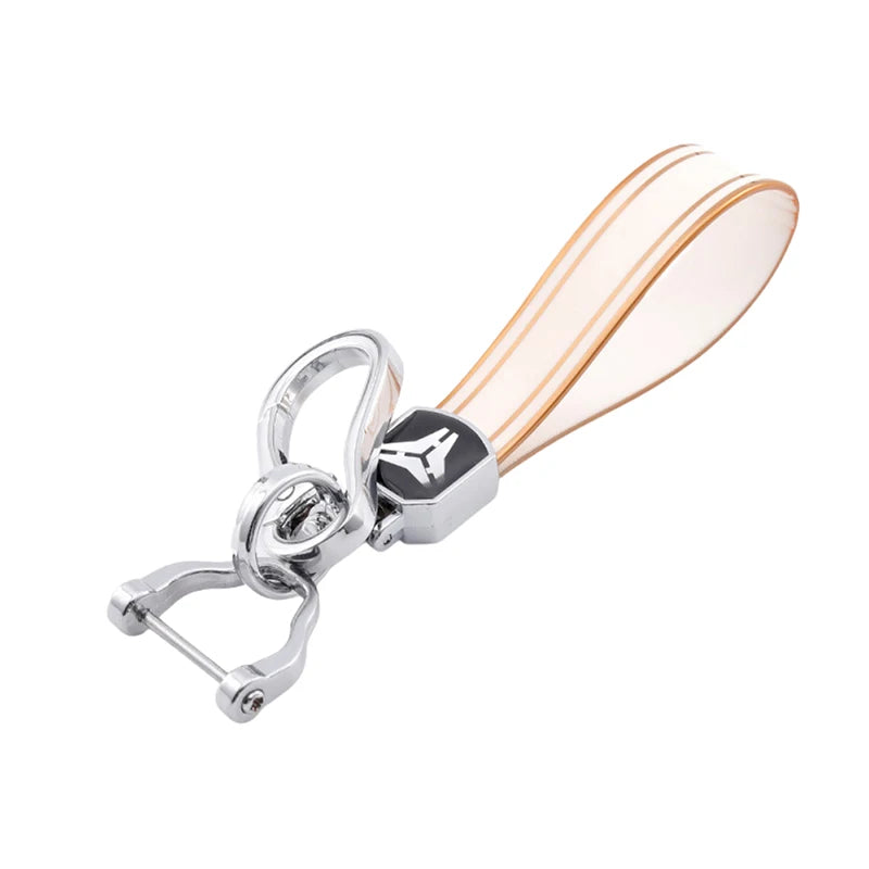 Silver TPU car key case cover with a translucent orange-pink body and a metal split ring.