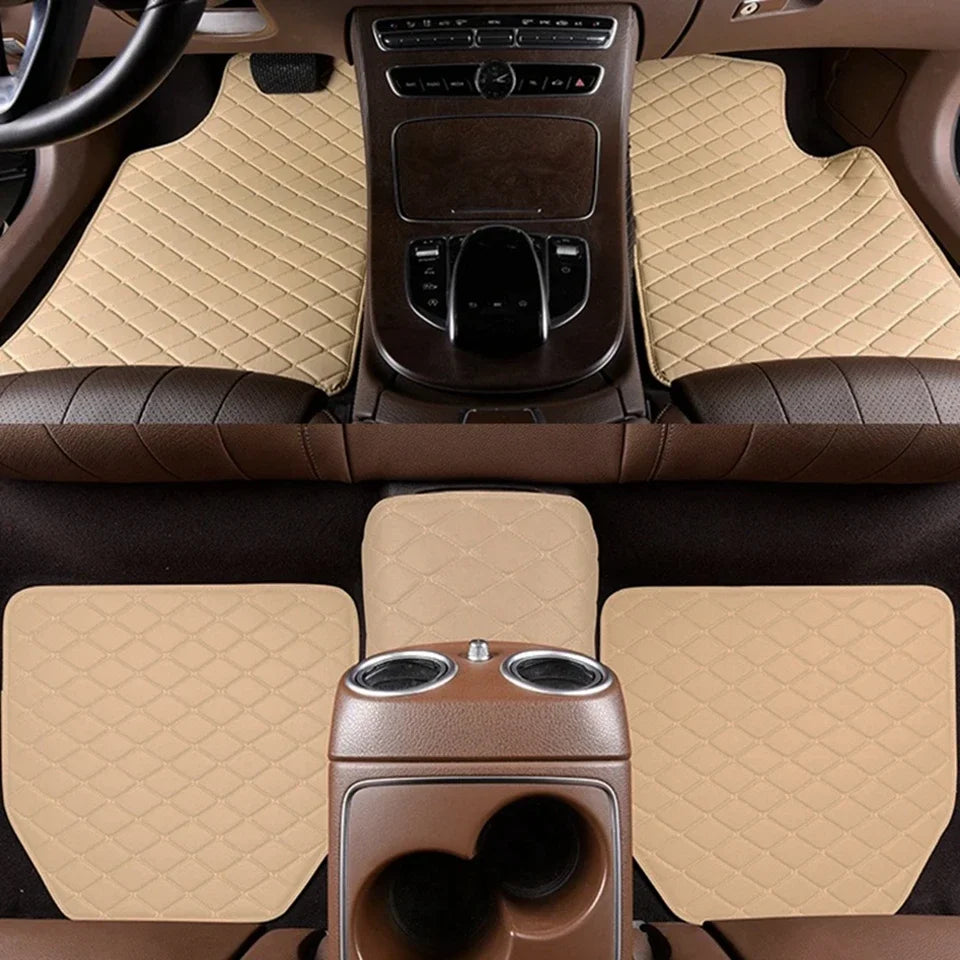 Interior view of a car with tan quilted floor mats and dark brown leather upholstery.
