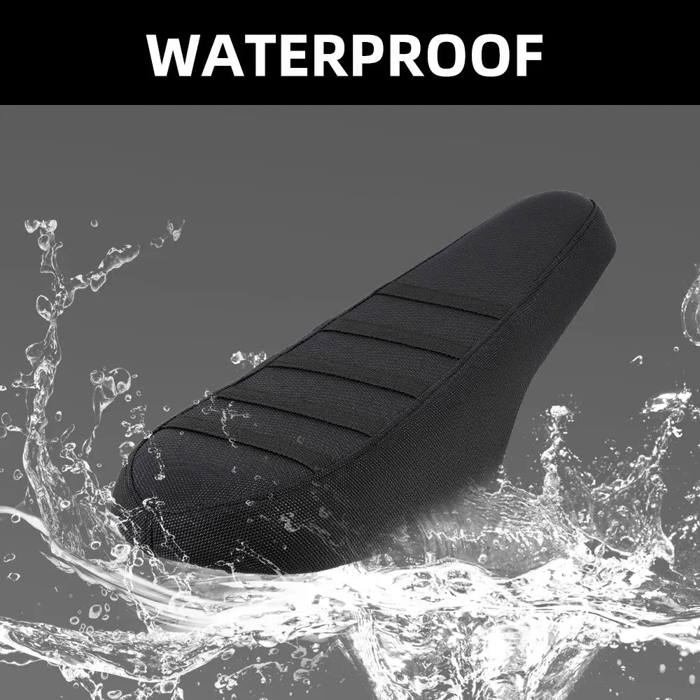 A black motorcycle seat cover for e-bikes and scooters being splashed by water.