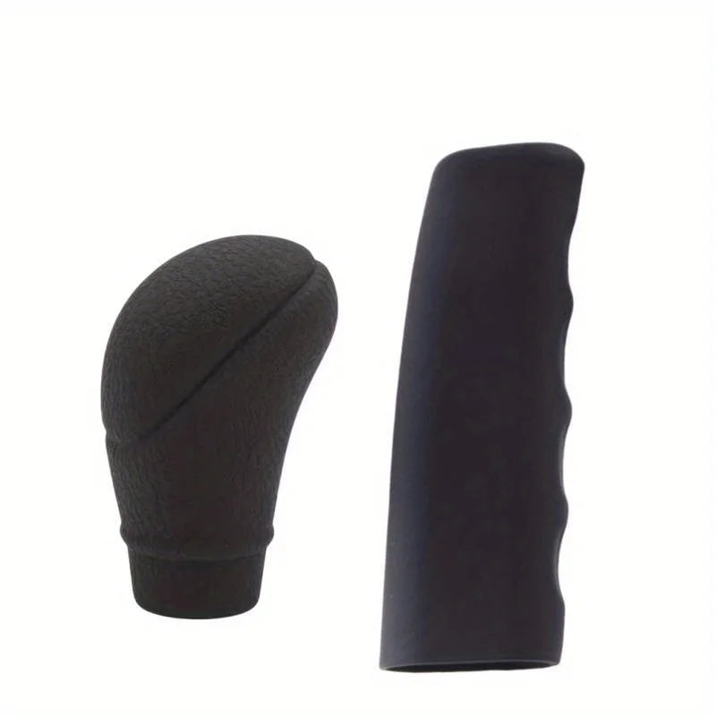 A set of black car gear shift knob and handbrake covers.