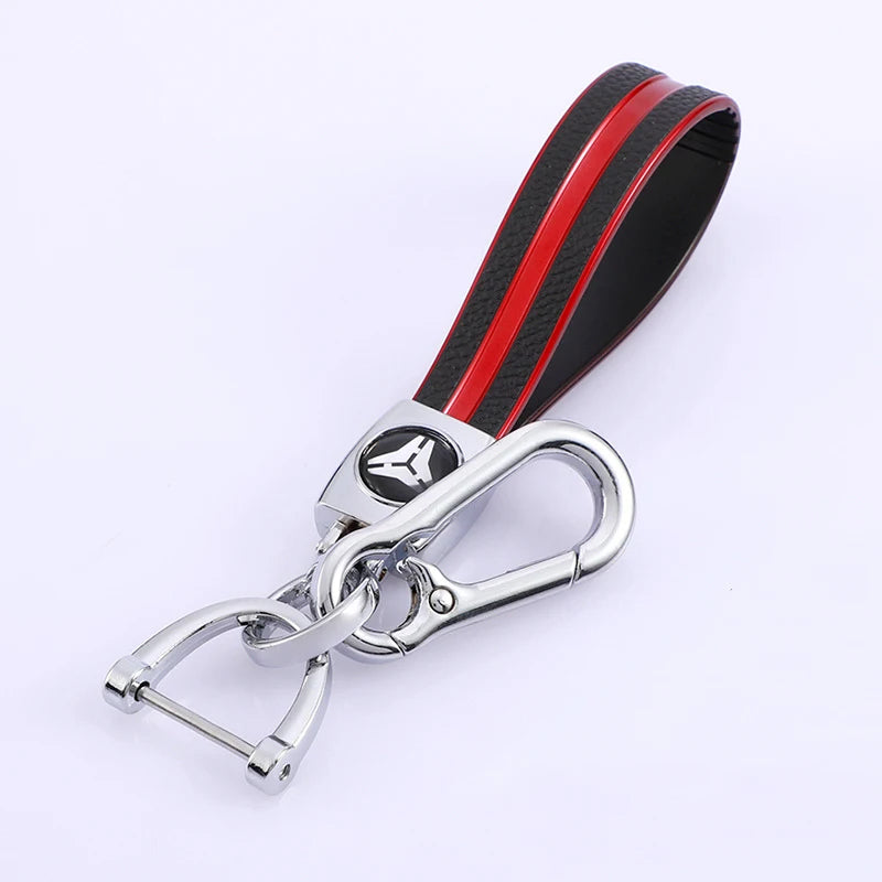 A black and red multi-function key fob holder with a silver chain attached.