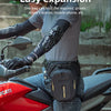 A person wearing a grey shirt and black gloves is mounting a red motorcycle with a black rider bag attached.