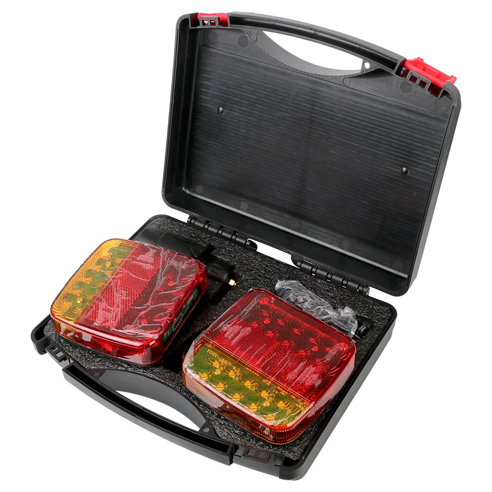 A black magnetic wireless LED tail light kit with two red and green colored lights inside the compartment.