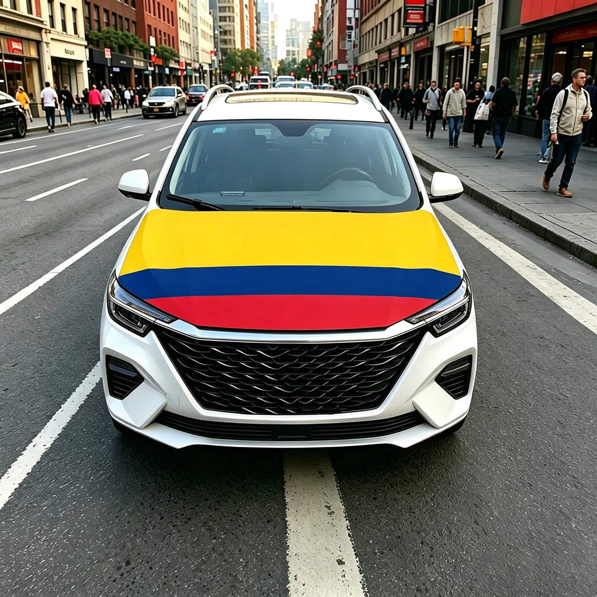 A white car with a flag design featuring yellow, blue, and red stripes on the hood driving on a city street.