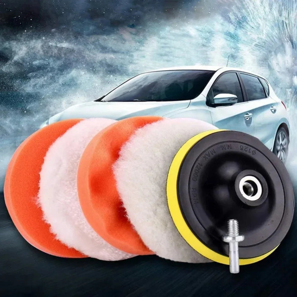 A professional car polishing pad kit showing orange and white foam pads next to a black and yellow polishing disc.