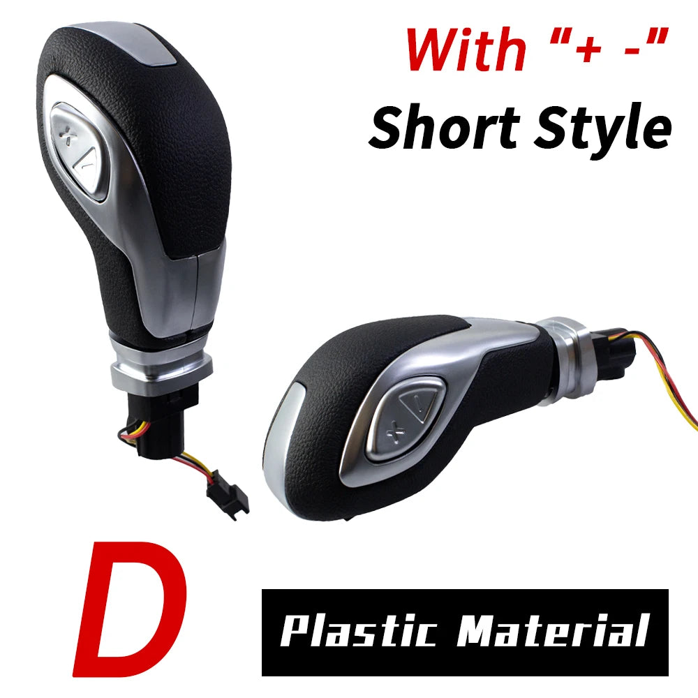 A short style gear shift knob made of plastic material with plus and minus markings.