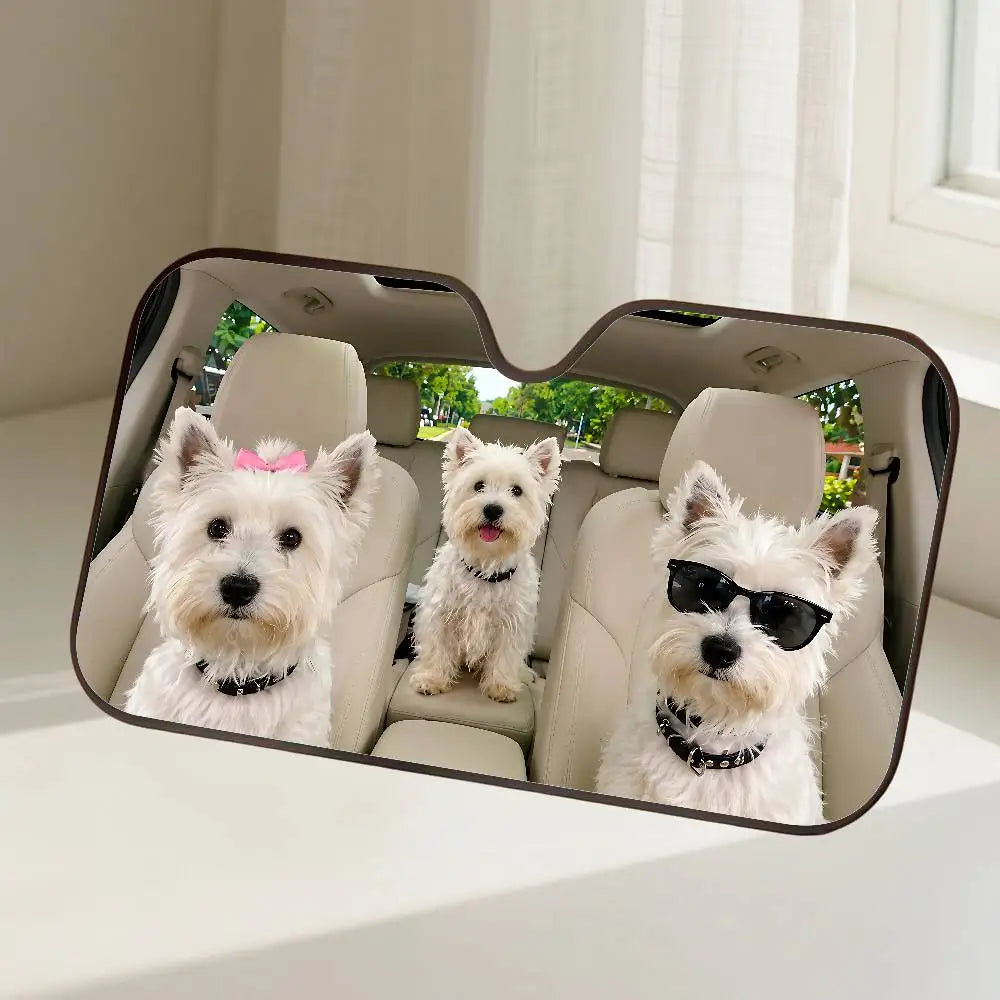 A dog-themed car windshield sunshade featuring three small white dogs looking out.