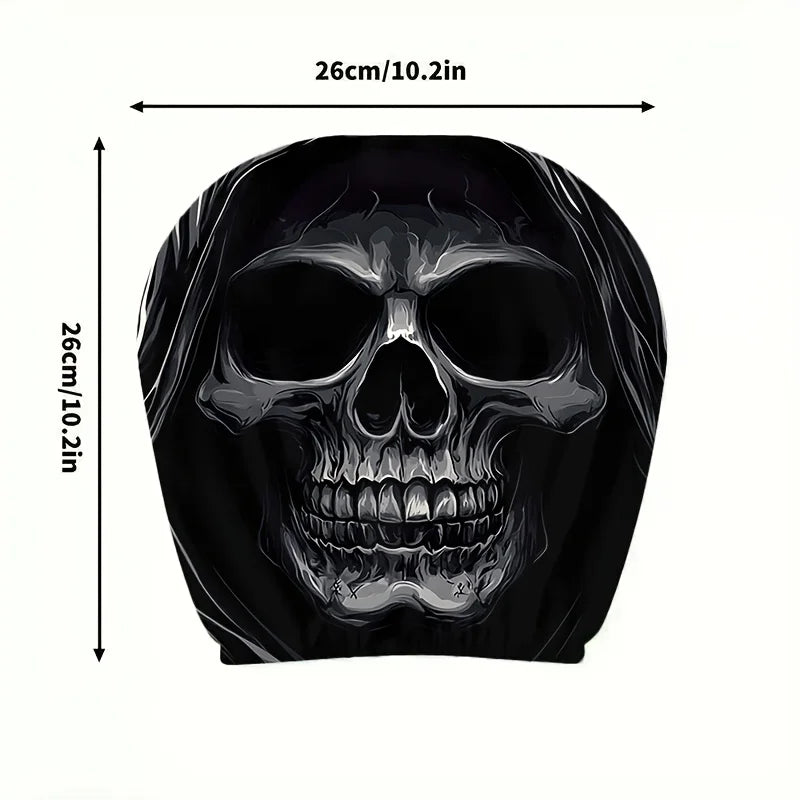 A black portrait print featuring a detailed skull design on a car headrest cover.