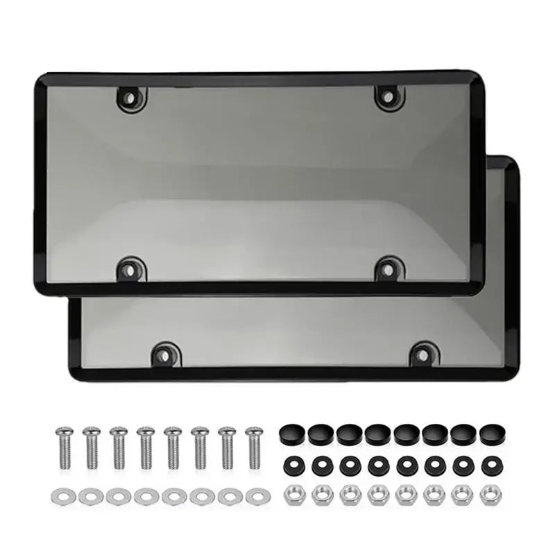 A set of license plate protectors including a clear plastic cover and various mounting hardware.