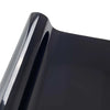 Close-up view of a glossy black vinyl car wrap film surface.